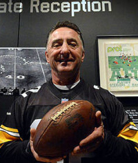 Man holding Immaculate Reception football